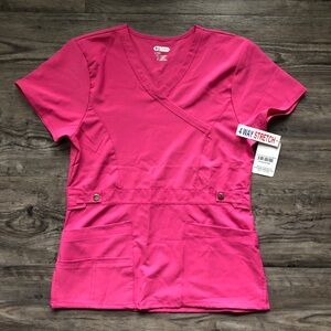 Scrubaid women’s Pink scrub top 4 way stretch size small
